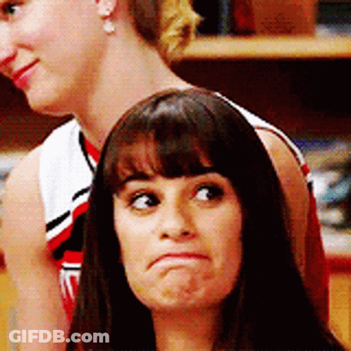 Woman Making Face While Another Looks On GIF