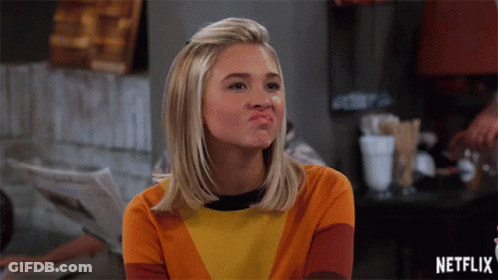 Woman Making Face With Netflix Logo GIF