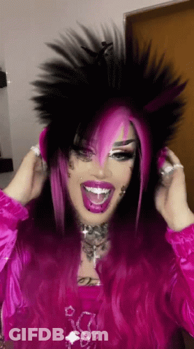 Woman Making Funny Face And Finger To Ear GIF