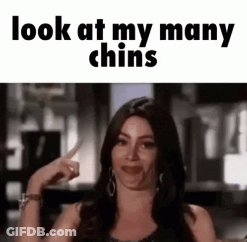 Woman Making Funny Face And Pointing At Chins GIF