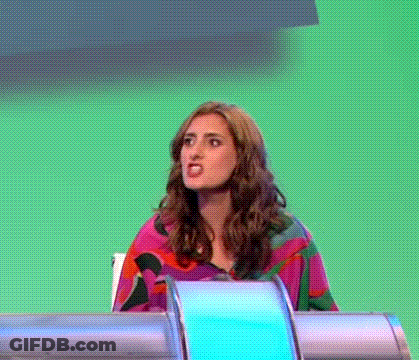 Woman Making Funny Face At Desk Green Background GIF