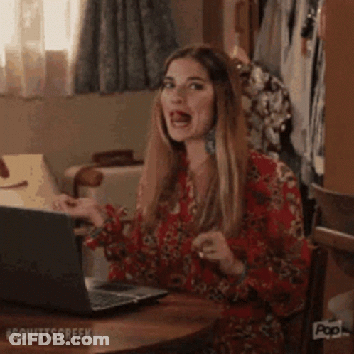 Woman Making Funny Face At Laptop GIF