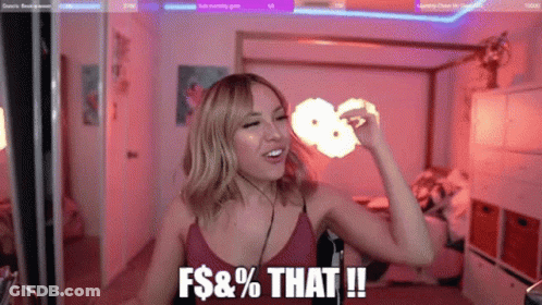 Woman Making Funny Face At Microphone In Bedroom GIF