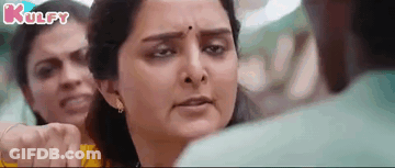 Woman Making Funny Face Beside Man And Two Women GIF