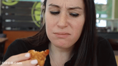 Woman Making Funny Face Eating Chicken GIF