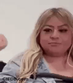 Woman Making Funny Face Holding Donut GIF
