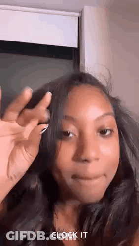 Woman Making Funny Face Holding Hair GIF