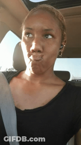 Woman Making Funny Face In Back Seat Of Car GIF