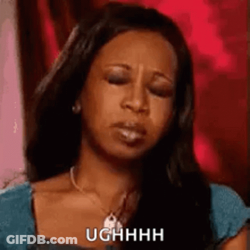 Woman Making Funny Face In Blue Shirt And Necklace GIF
