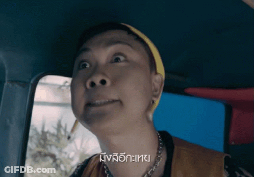 Woman Making Funny Face In Car GIF