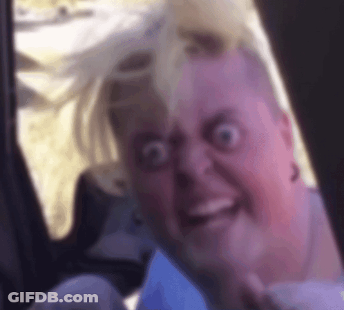 Woman Making Funny Face In Car GIF
