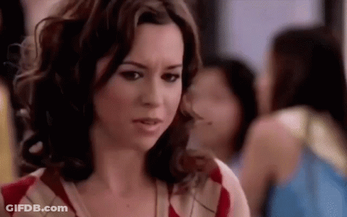 Woman Making Funny Face In Crowd GIF