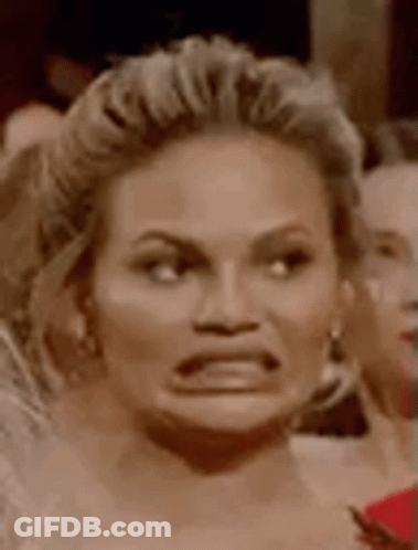 Woman Making Funny Face In Crowd GIF