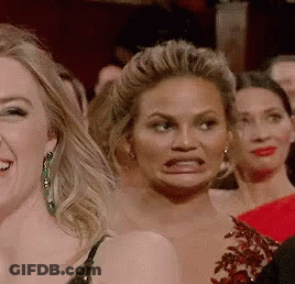 Woman Making Funny Face In Crowd GIF
