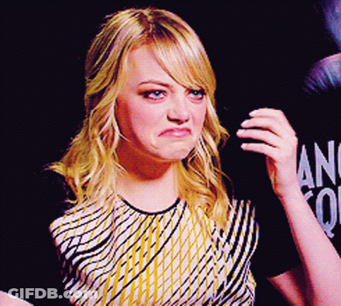 Woman Making Funny Face In Front Of Ang Sign GIF