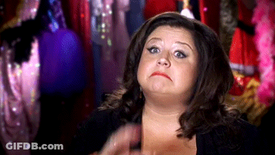 Woman Making Funny Face In Front Of Closet GIF