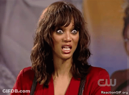 Woman Making Funny Face In Front Of CW Sign GIF