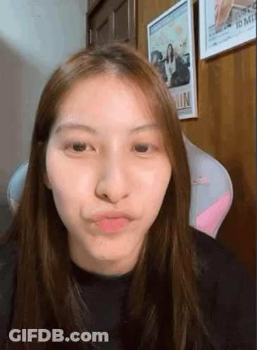 Woman Making Funny Face In Front Of Justco 10 Mil Picture GIF