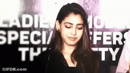 Woman Making Funny Face In Front Of Ladies Special Offer Sign GIF