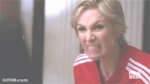 Woman Making Funny Face In Red And White Striped Shirt GIF