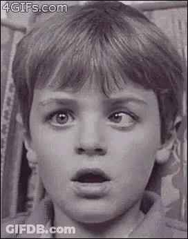 Woman Making Funny Face In Striped Shirt GIF