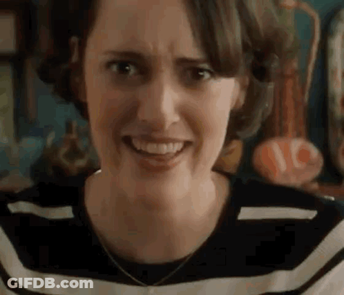 Woman Making Funny Face In Striped Shirt GIF