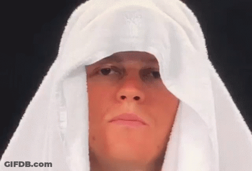 Woman Making Funny Face In Suit And Tie GIF