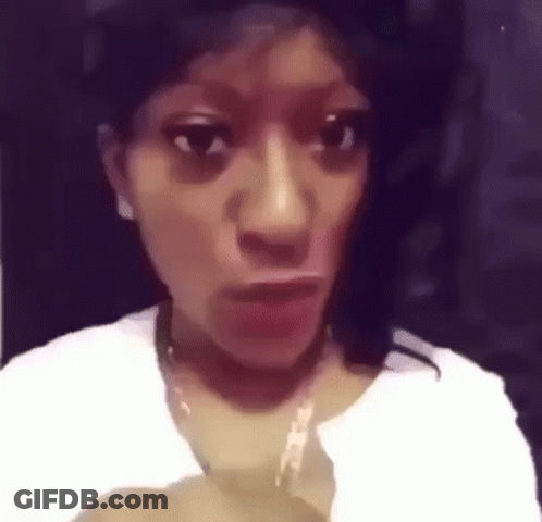 Woman Making Funny Face In White Shirt And Necklace GIF
