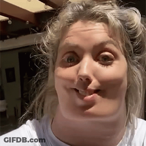 Woman Making Funny Face In White T-Shirt GIF