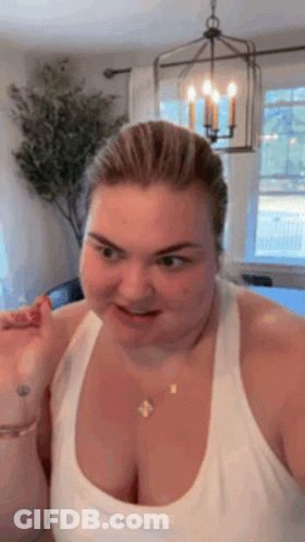 Woman Making Funny Face In White Tank Top GIF