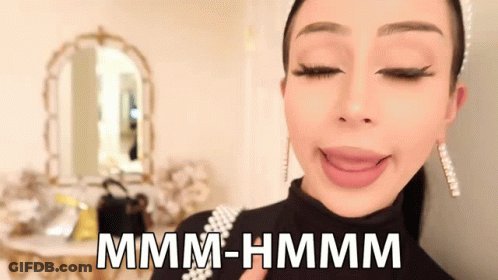 Woman Making Funny Face Mmmm Hmmm GIF