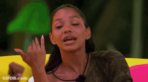 Woman Making Funny Face On Colorful Couch GIF