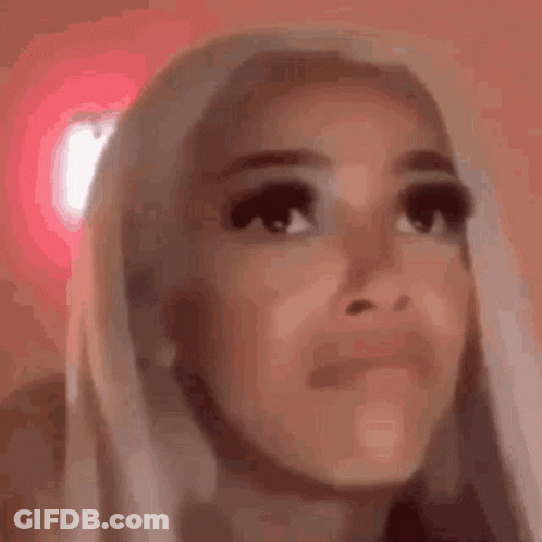 Woman Making Funny Face On Pink Background GIF