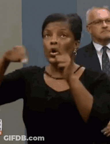 Woman Making Funny Face Pointing At Camera GIF