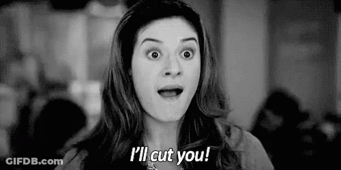 Woman Making Funny Face Saying I'll Cut You GIF