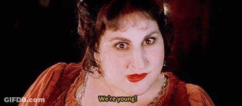 Woman Making Funny Face Saying We're Young GIF