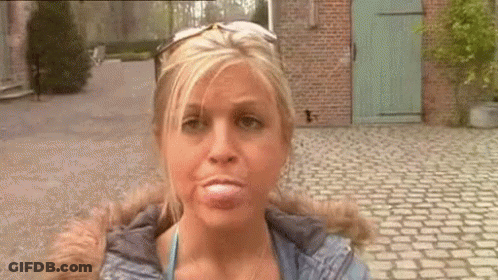 Woman Making Funny Face Wearing Sunglasses GIF