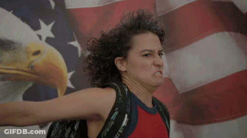 Woman Making Funny Face With American Flag GIF