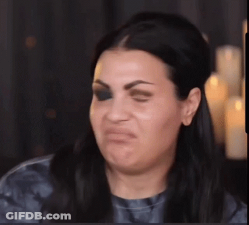 Woman Making Funny Face With Candles GIF