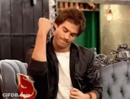 Woman Making Funny Face With Fist In Air GIF