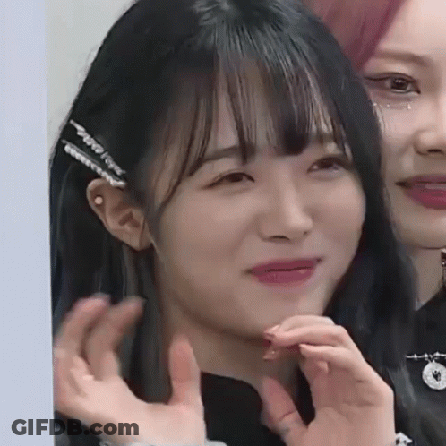 Woman Making Funny Face With Hand GIF
