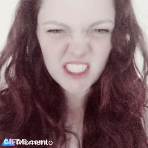 Woman Making Funny Face With Momento Logo GIF
