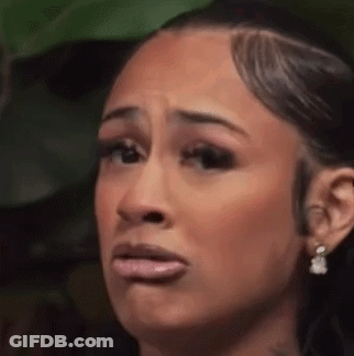 Woman Making Funny Face With Mouth Open And Earrings GIF