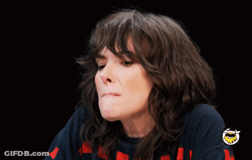 Woman Making Funny Face With Shark On Sleeve GIF