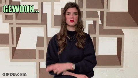Woman Making Gesture With Gewoon Behind Her GIF
