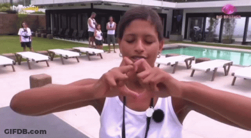Woman Making Heart Hands At Big Brother House GIF