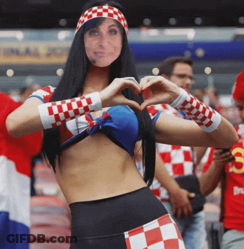 Woman Making Heart Shape In Front Of Final Point Sign GIF