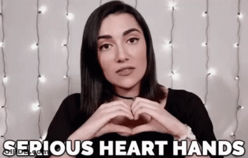 Woman Making Heart Shape Saying Serious Heart Hands GIF