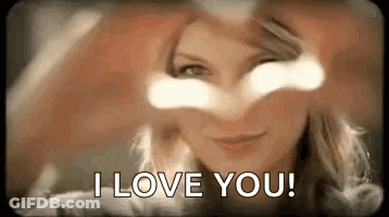 Woman Making Heart With Hands Saying I Love You GIF