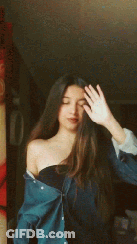 Woman Making Peace Sign GIF
